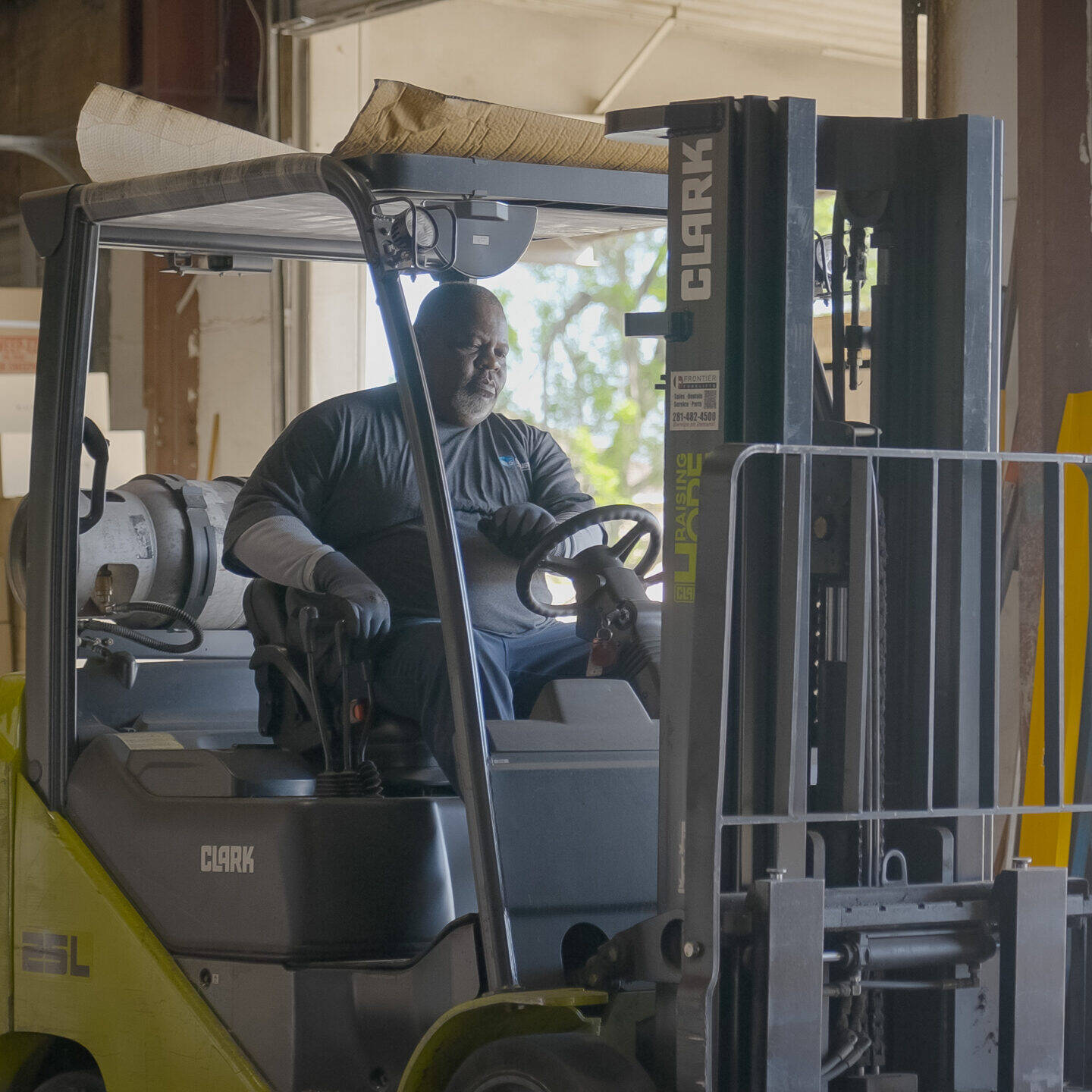 warehouse worker operating a forklift